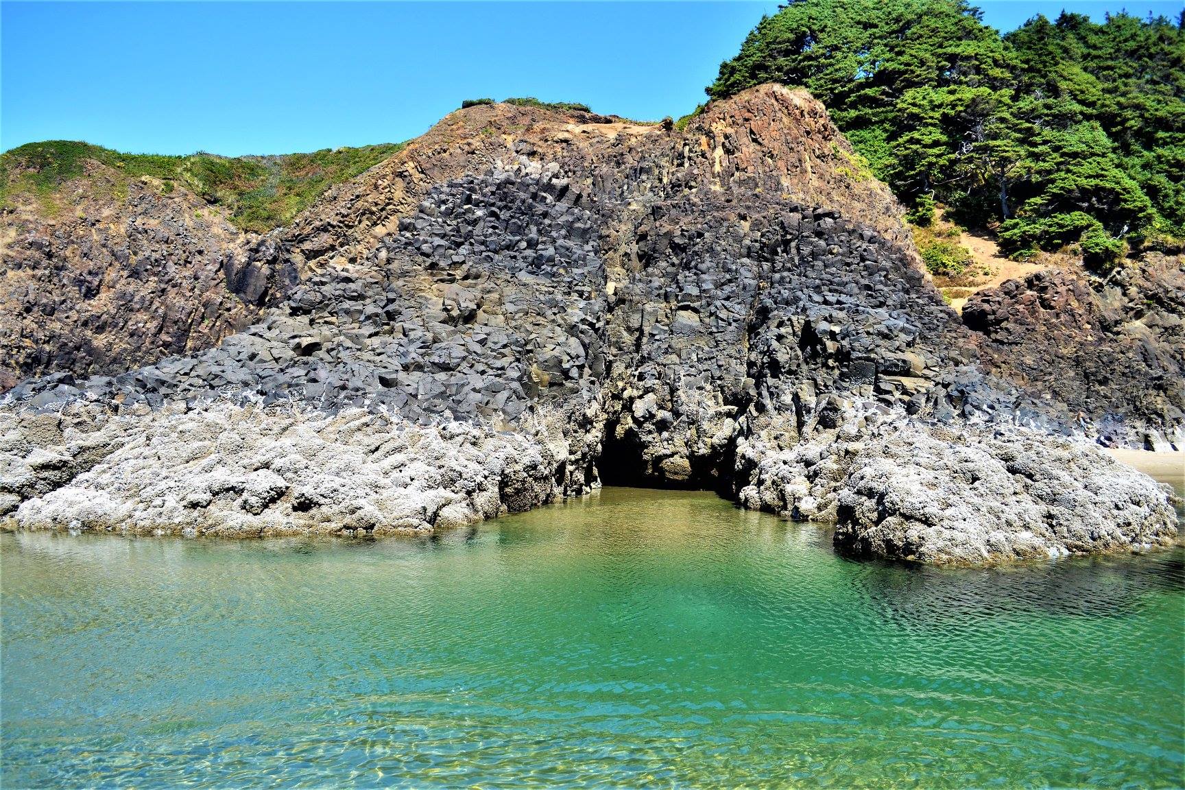 coastal rock formations and caves at cannon beach
