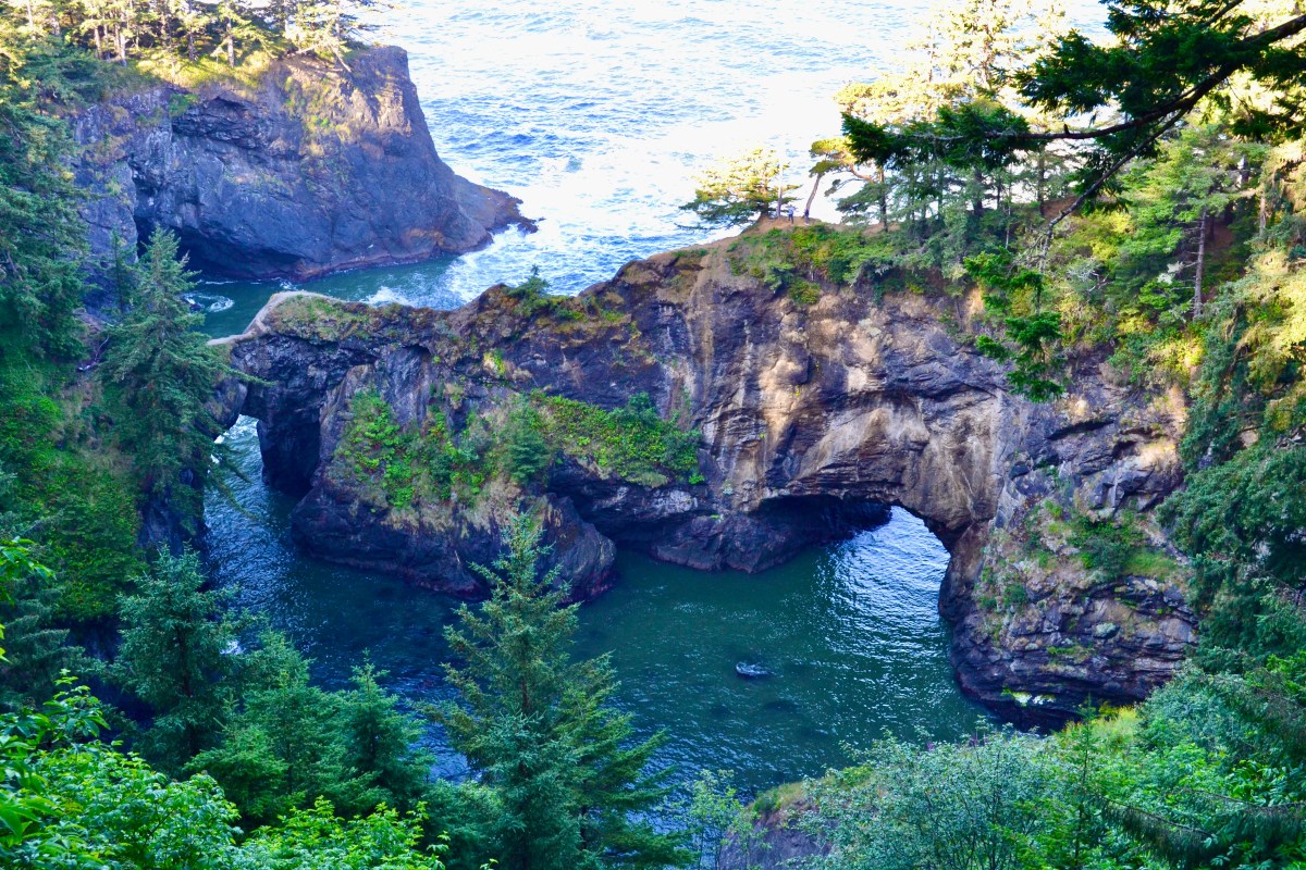 Twin sea arches known as the Natural Bridges along the Samuel H Boardman State Scenic Corridor