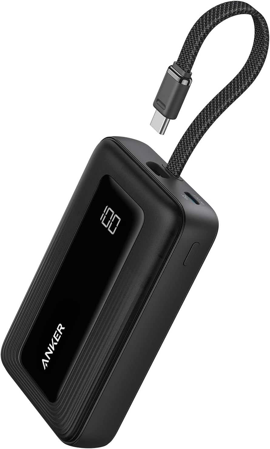 Anker Zolo 20K power bank with built-in USB-C cable on a trailhead picnic table