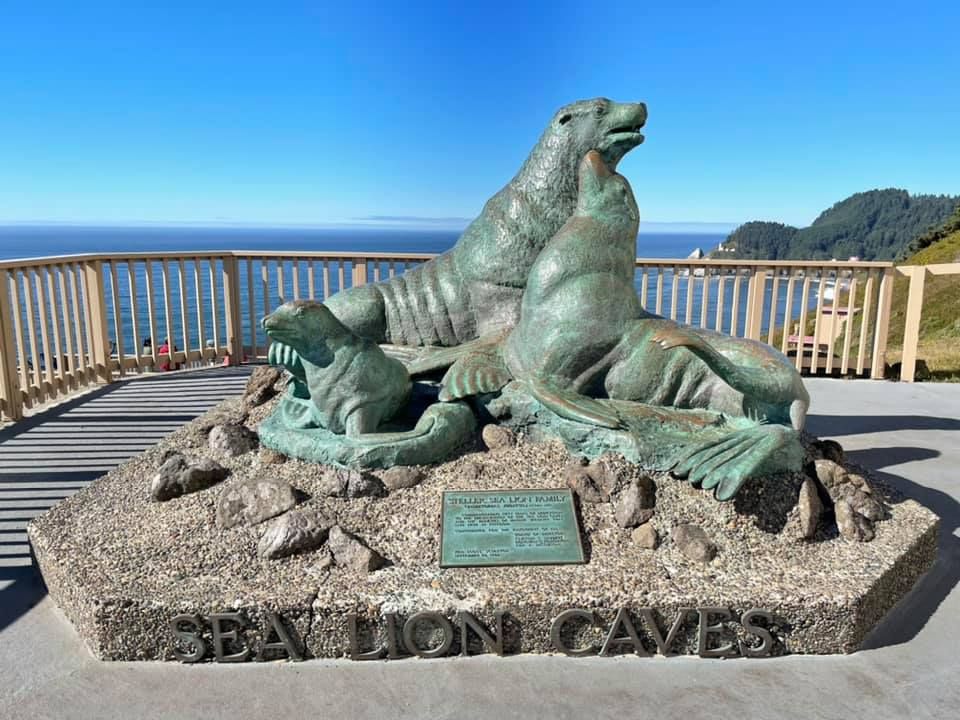 The world largest sea cave sign and sea lion statue at the entrance to Sea Lion Caves on the Oregon Coast