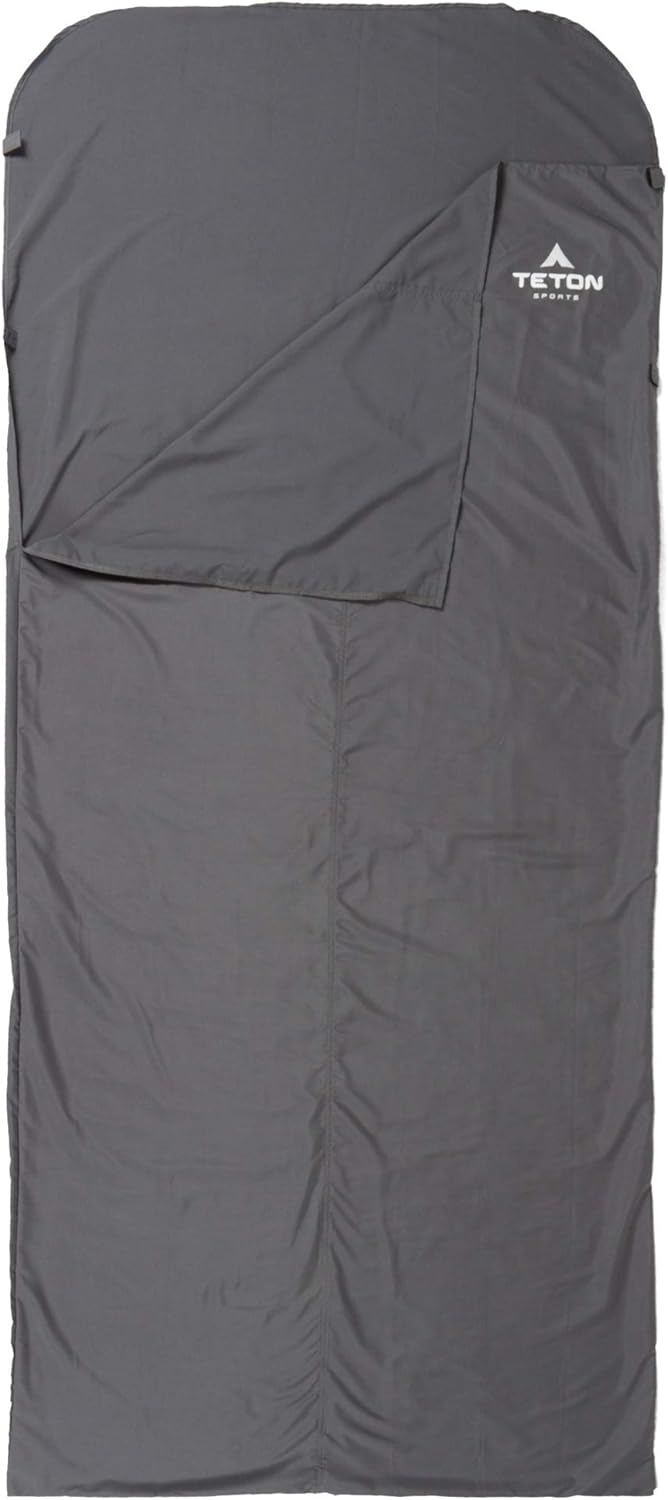 TETON Sports sleeping bag liner rolled beside its stuff sack